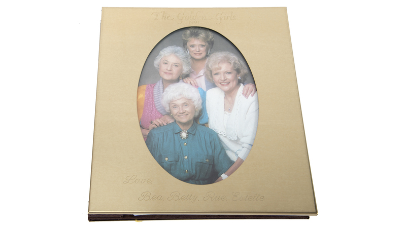In addition to Sue Ann Nivens, White won an Emmy for playing Rose Nylund on “The Golden Girls.” Included in the auction are a number of gifts the show’s stars four stars—White, Bea Arthur, Rue McClanahan and Estelle Getty—had made for the crew, like this engraved pictured frame ($500 to $700). (Photo credit: Julien’s Auctions)